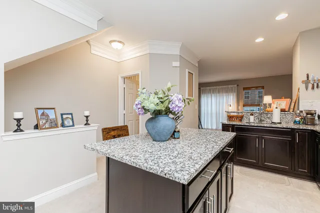 a kitchen with a table and chairs in it
