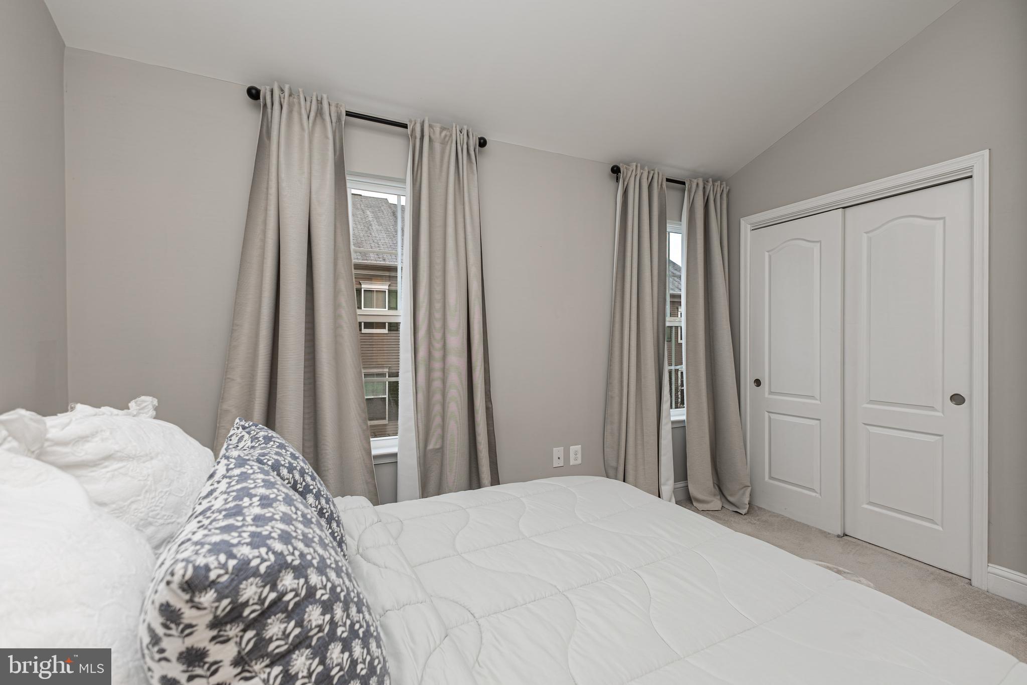 4336 Potomac Highlands Circle, Unit 51 Triangle, VA 22172 - Photo 17 of 40 a bedroom with a bed and a window