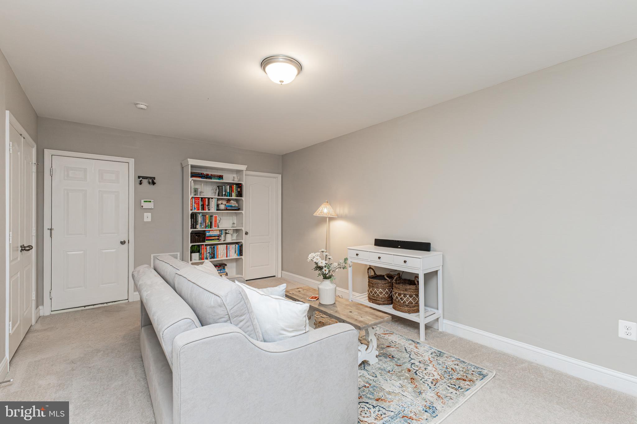 4336 Potomac Highlands Circle, Unit 51 Triangle, VA 22172 - Photo 2 of 40 a living room with furniture a fireplace and a flat screen tv