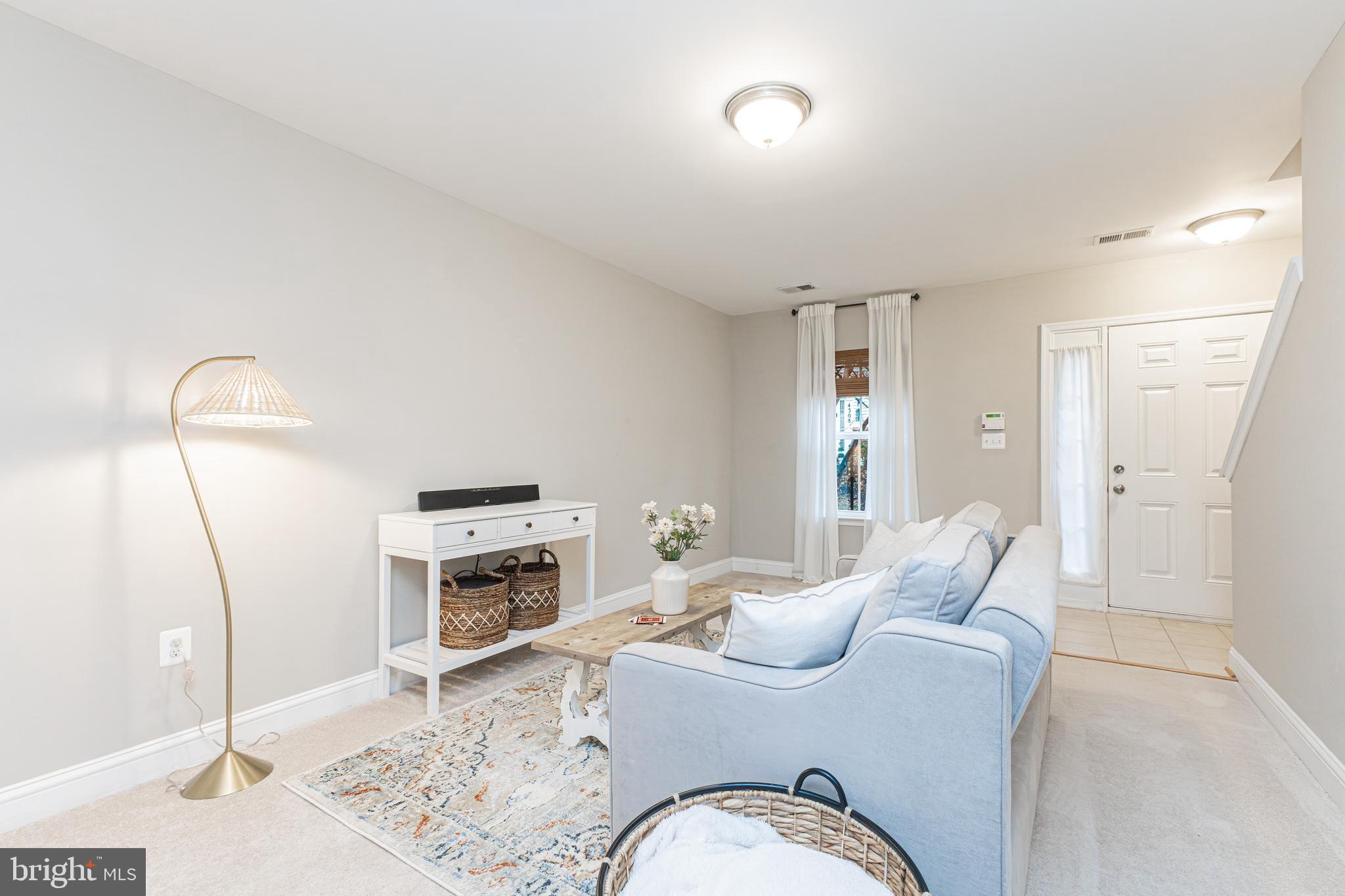 4336 Potomac Highlands Circle, Unit 51 Triangle, VA 22172 - Photo 4 of 40 a living room with furniture fireplace and a mirror