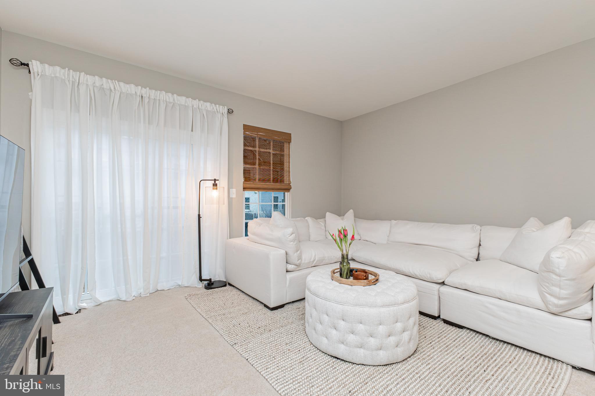 4336 Potomac Highlands Circle, Unit 51 Triangle, VA 22172 - Photo 6 of 40 a living room with furniture and a window