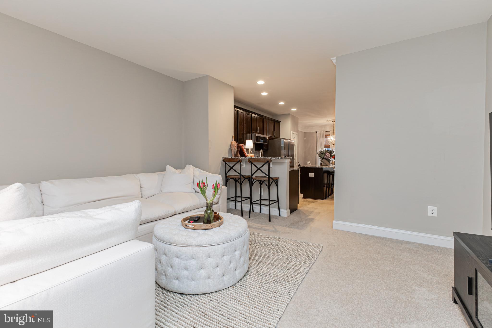 4336 Potomac Highlands Circle, Unit 51 Triangle, VA 22172 - Photo 7 of 40 a living room with furniture and kitchen view