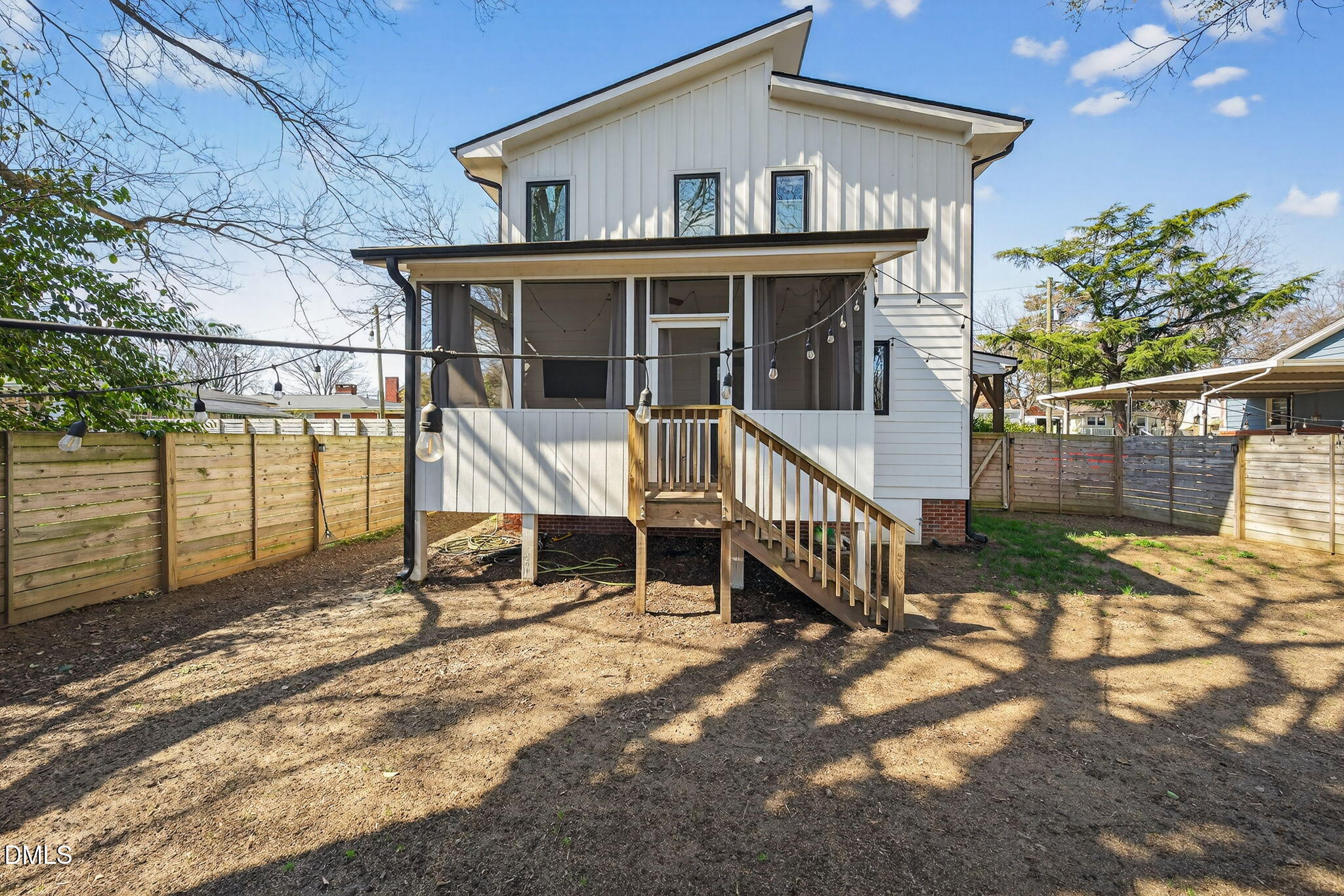 213 Lincoln Court Raleigh, NC 27610 - Photo 37 of 40 a view of house with a large window and wooden fence