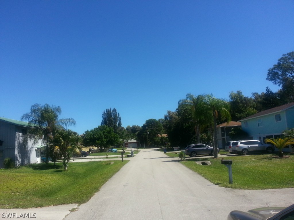 8433 Wren Road Fort Myers, FL 33967 - Photo 3 of 6 a view of a swimming pool and a yard