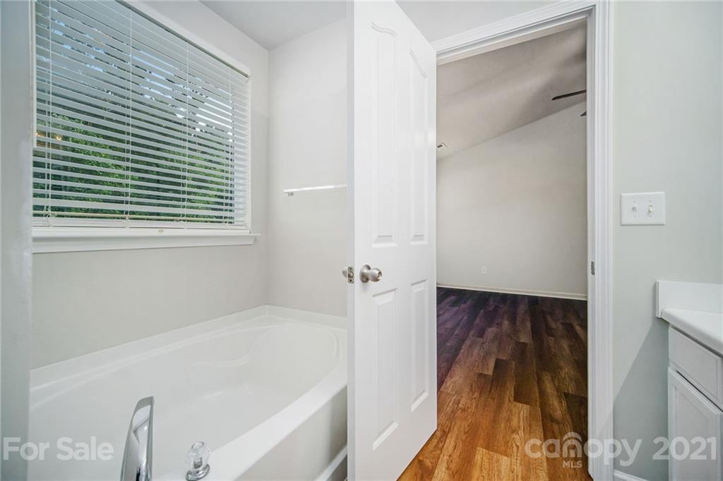 1046 Mearn Road Charlotte, NC 28216 - Photo 22 of 30 a bathroom with a bathtub and a shower