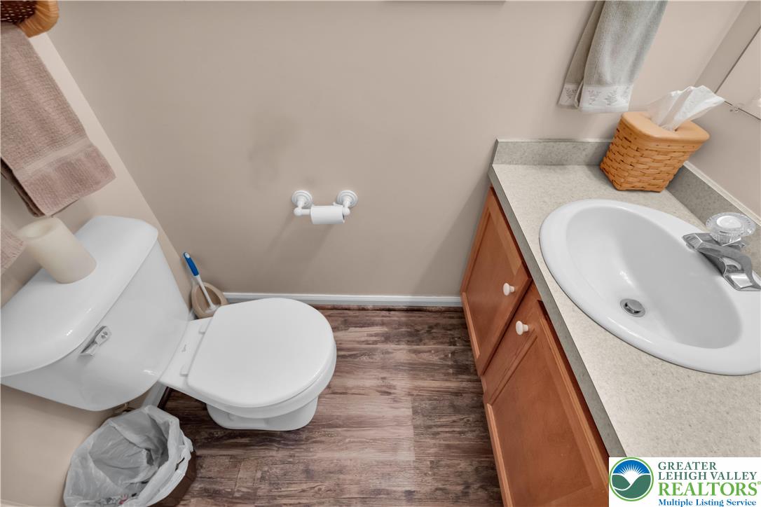 5920 Michael's Crossing Orefield, PA 18069 - Photo 16 of 31 a bathroom with a sink mirror vanity and toilet