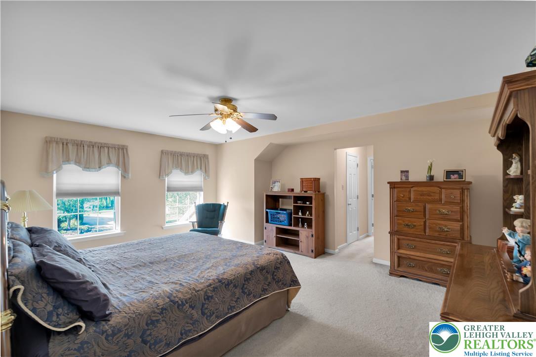 5920 Michael's Crossing Orefield, PA 18069 - Photo 18 of 31 a bed room with a bed and a large window