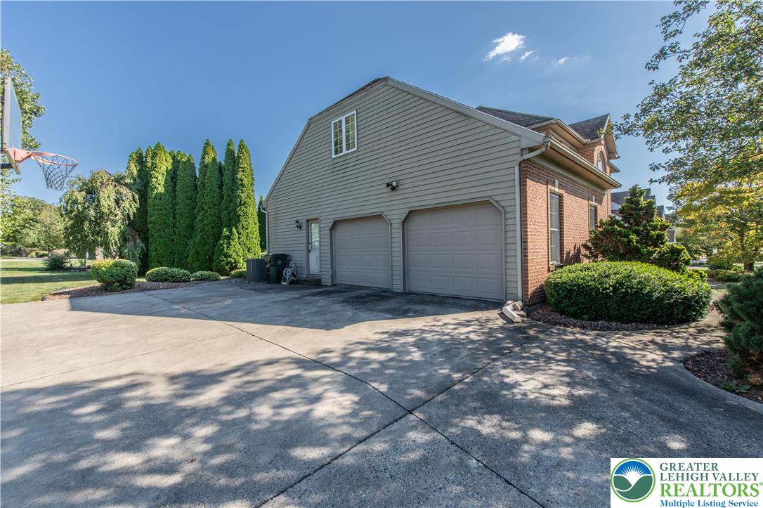 5920 Michael's Crossing Orefield, PA 18069 - Photo 2 of 31 a backyard of a house with plants and trees
