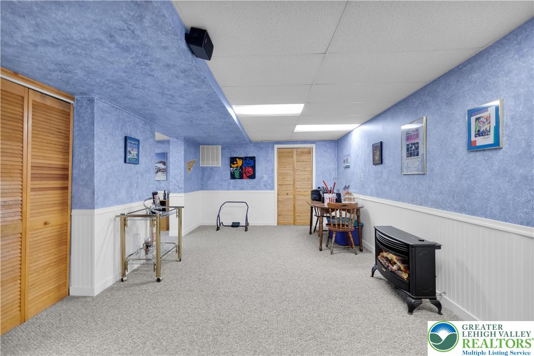 5920 Michael's Crossing Orefield, PA 18069 - Photo 30 of 31 a view of livingroom with furniture and fireplace