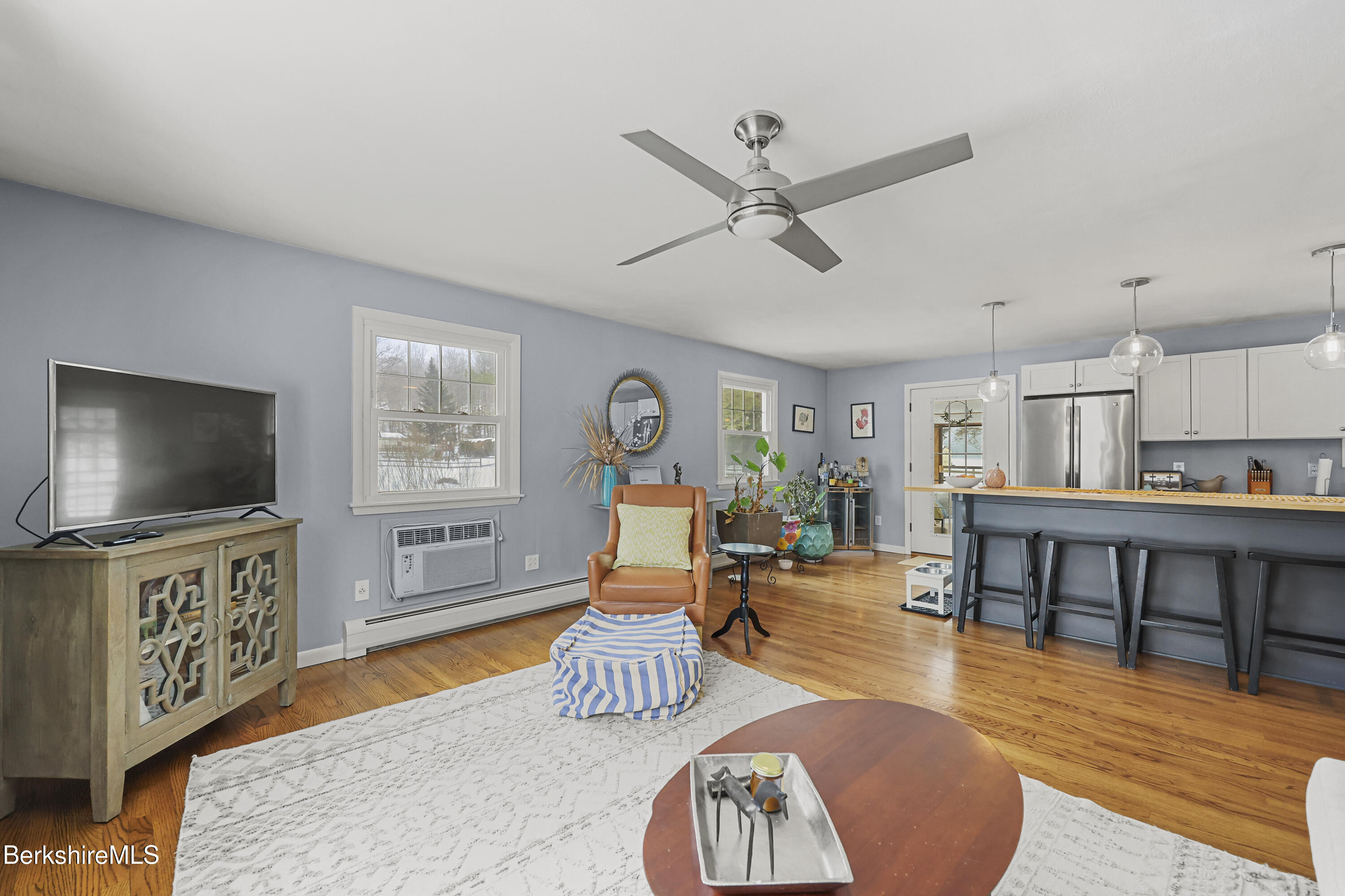 184 Washington Mountain Road Lee, MA 01238 - Photo 11 of 42 a living room with furniture and a flat screen tv