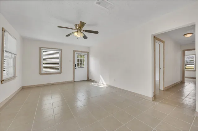 a view of an empty room with a window