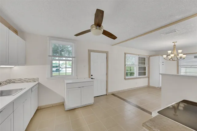 a kitchen with a stove a sink and a refrigerator