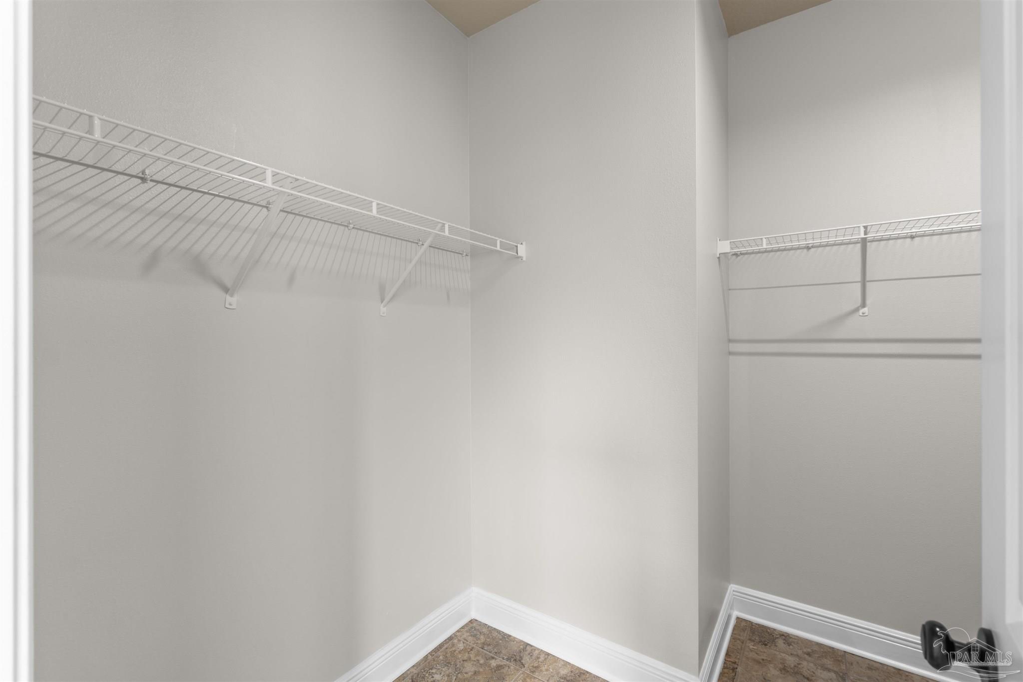 2698 Tulip Hill Road Pace, FL 32571 - Photo 49 of 65 a view of a room with racks on the wall