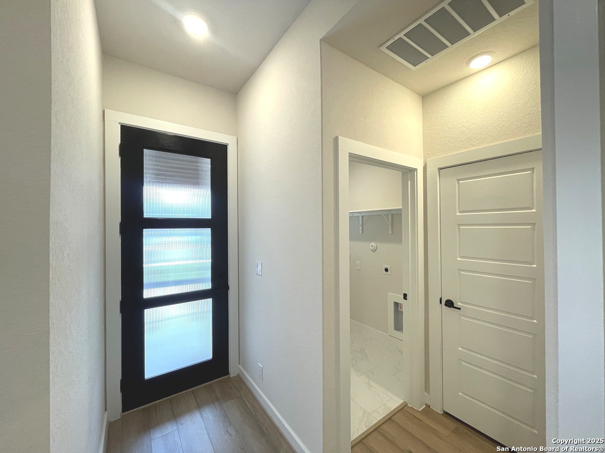 116 Radnor Road New Braunfels, TX 78130 - Photo 11 of 26 a view of a bathroom with a glass door