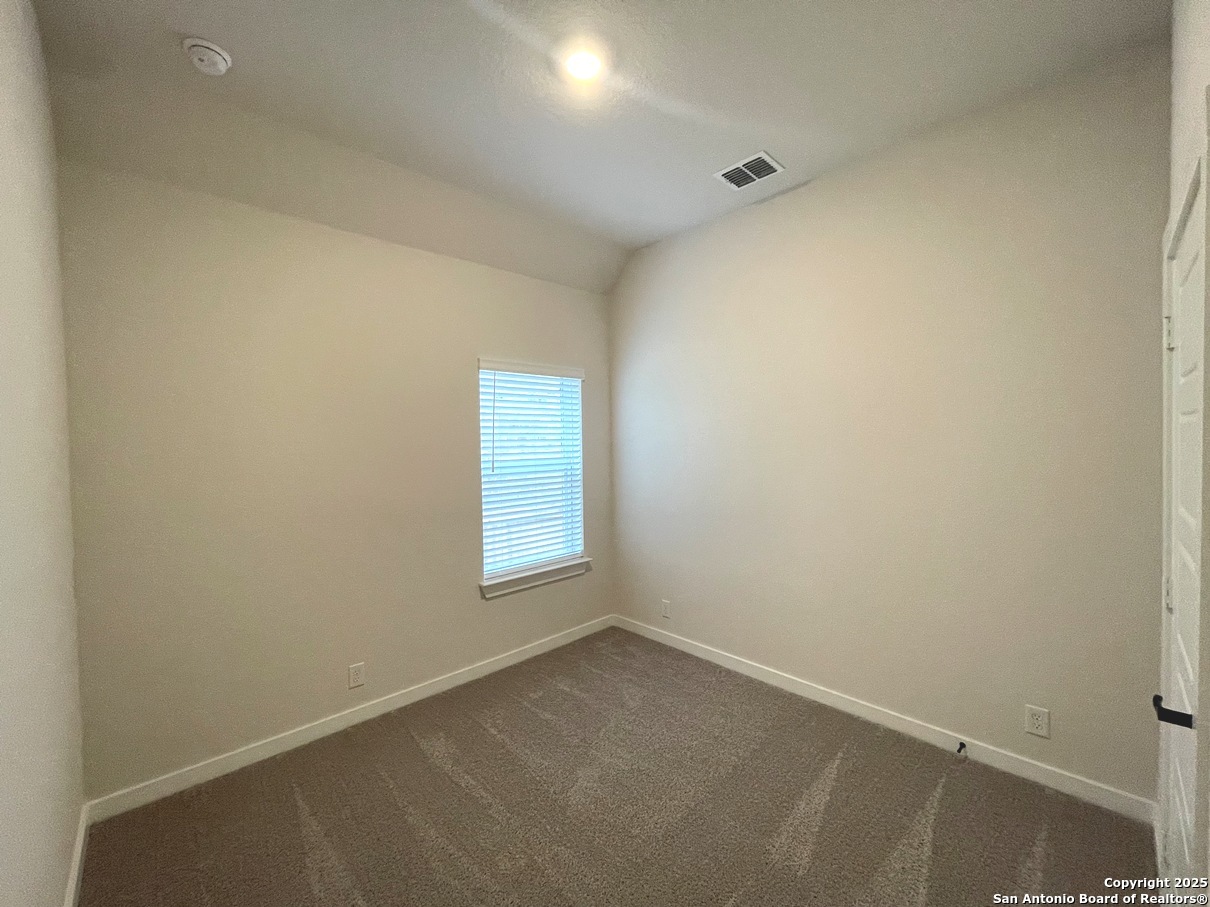 116 Radnor Road New Braunfels, TX 78130 - Photo 16 of 26 an empty room with a window