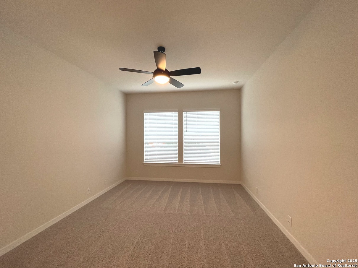 116 Radnor Road New Braunfels, TX 78130 - Photo 20 of 26 a view of an empty room with a window