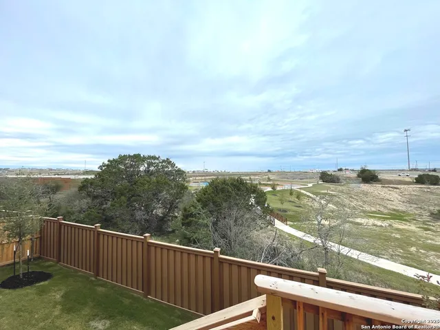 a view of a balcony with an ocean view