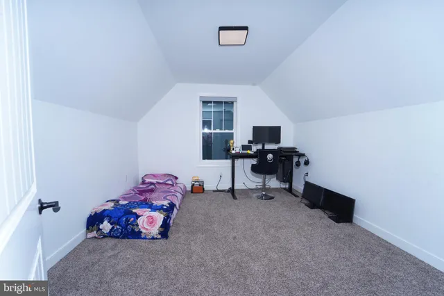 a kitchen with a refrigerator and a stove