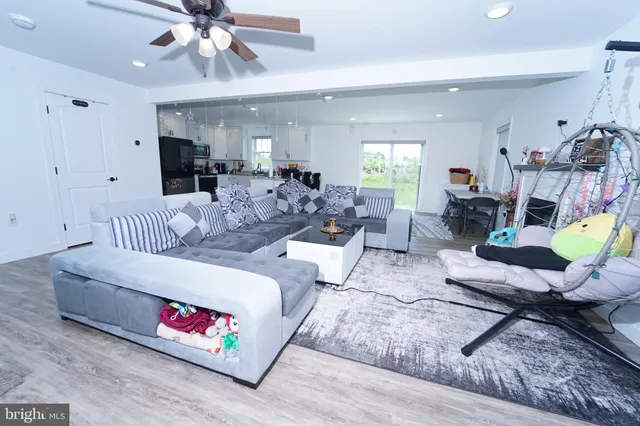 a living room with furniture fireplace and a flat screen tv