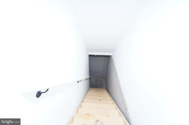 a view of room with window and a ceiling fan