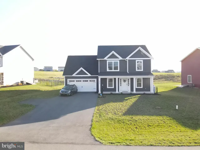 an aerial view of a house with a ocean view