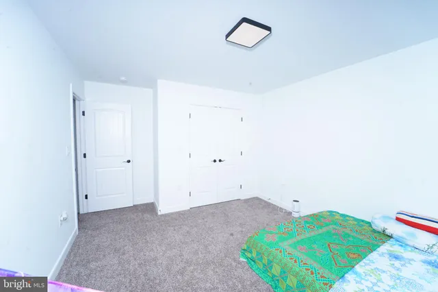 a view of walk in closet with clothes