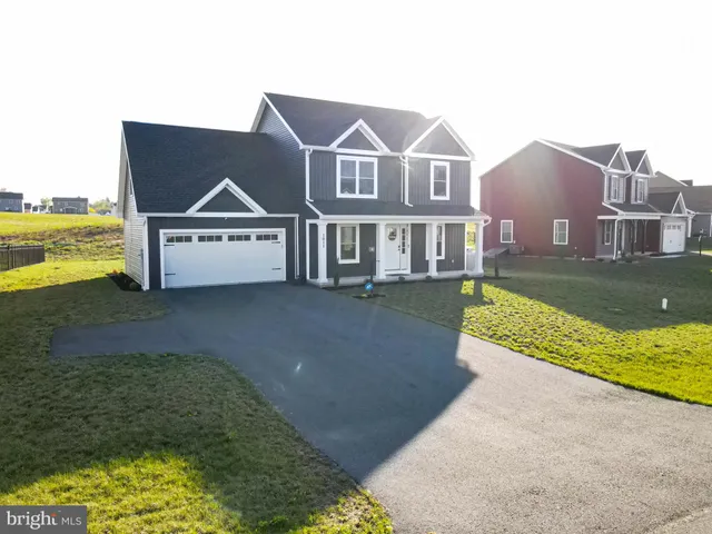 an aerial view of a house with a ocean view