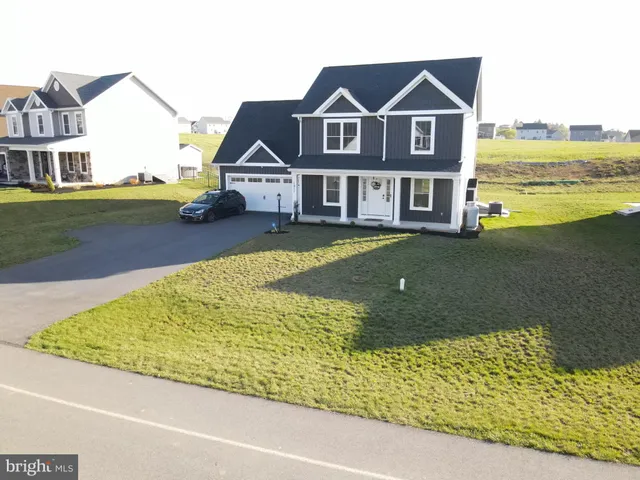 a aerial view of a house with a ocean view