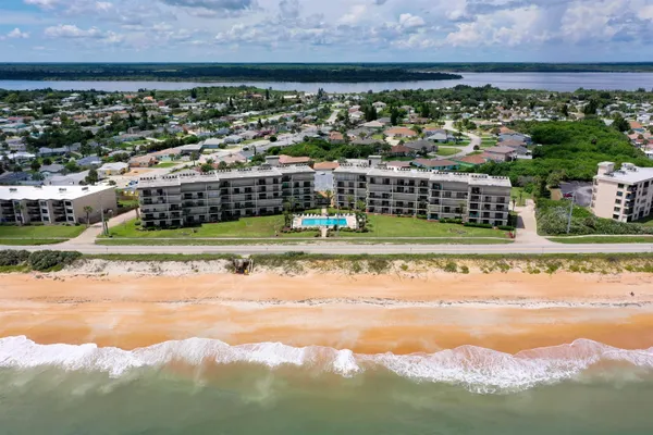 a view of a city with an ocean beach