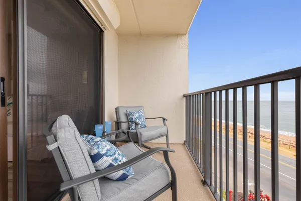 a view of balcony and dining room