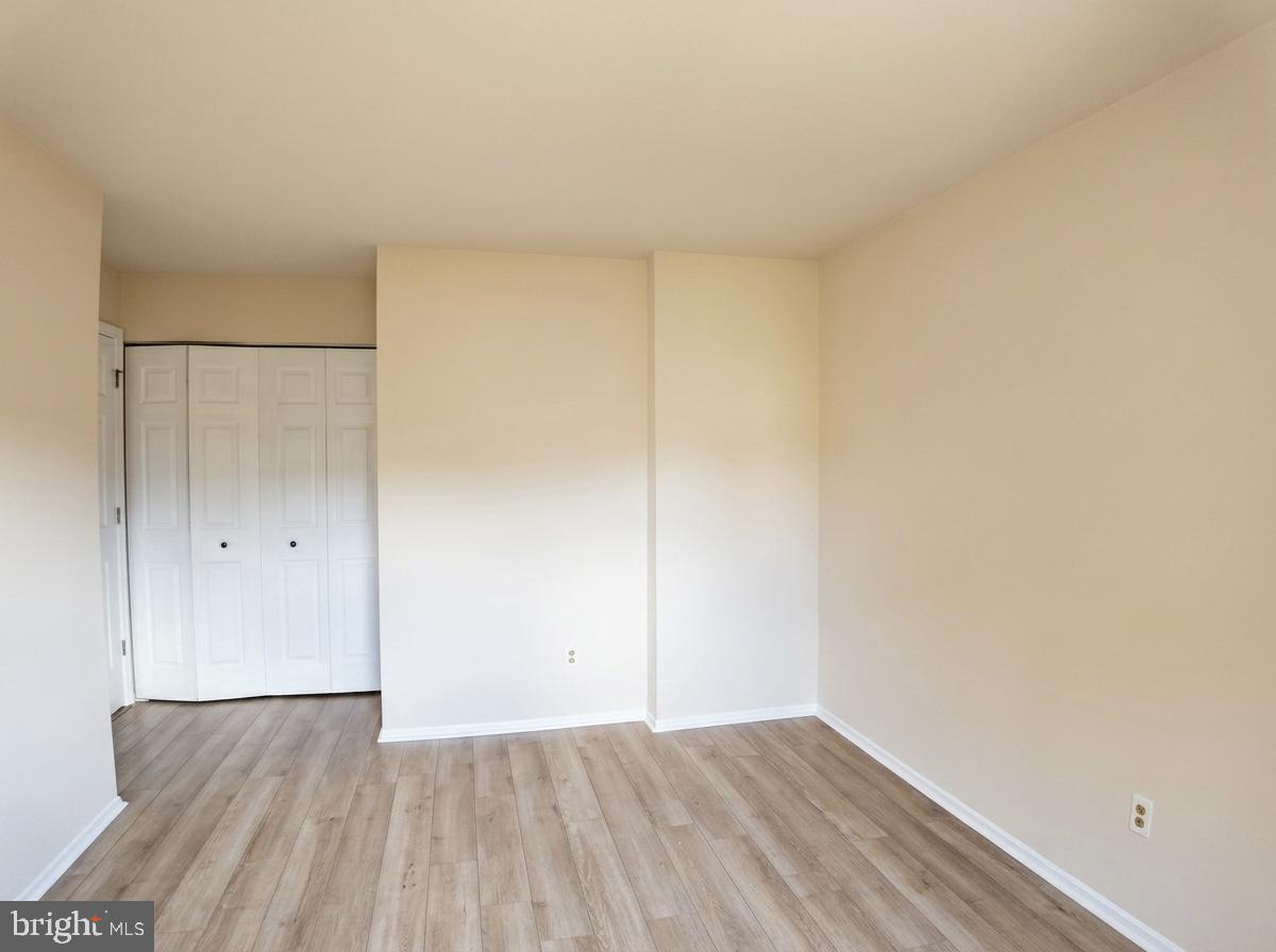 3614 Fawn Spring Court Baltimore, MD 21234 - Photo 12 of 22 a view of an empty room with wooden floor