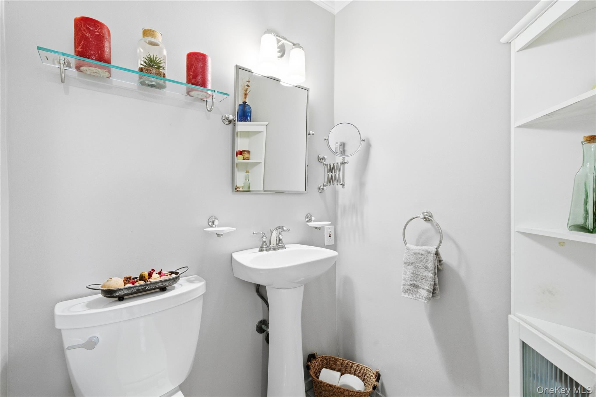 750 Shore Road, Unit 3O Long Beach, NY 11561 - Photo 12 of 23 a bathroom with a sink toilet and a mirror