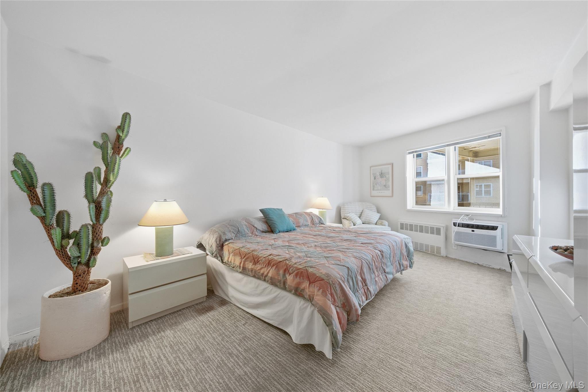 750 Shore Road, Unit 3O Long Beach, NY 11561 - Photo 13 of 23 a bedroom with a bed and a couch