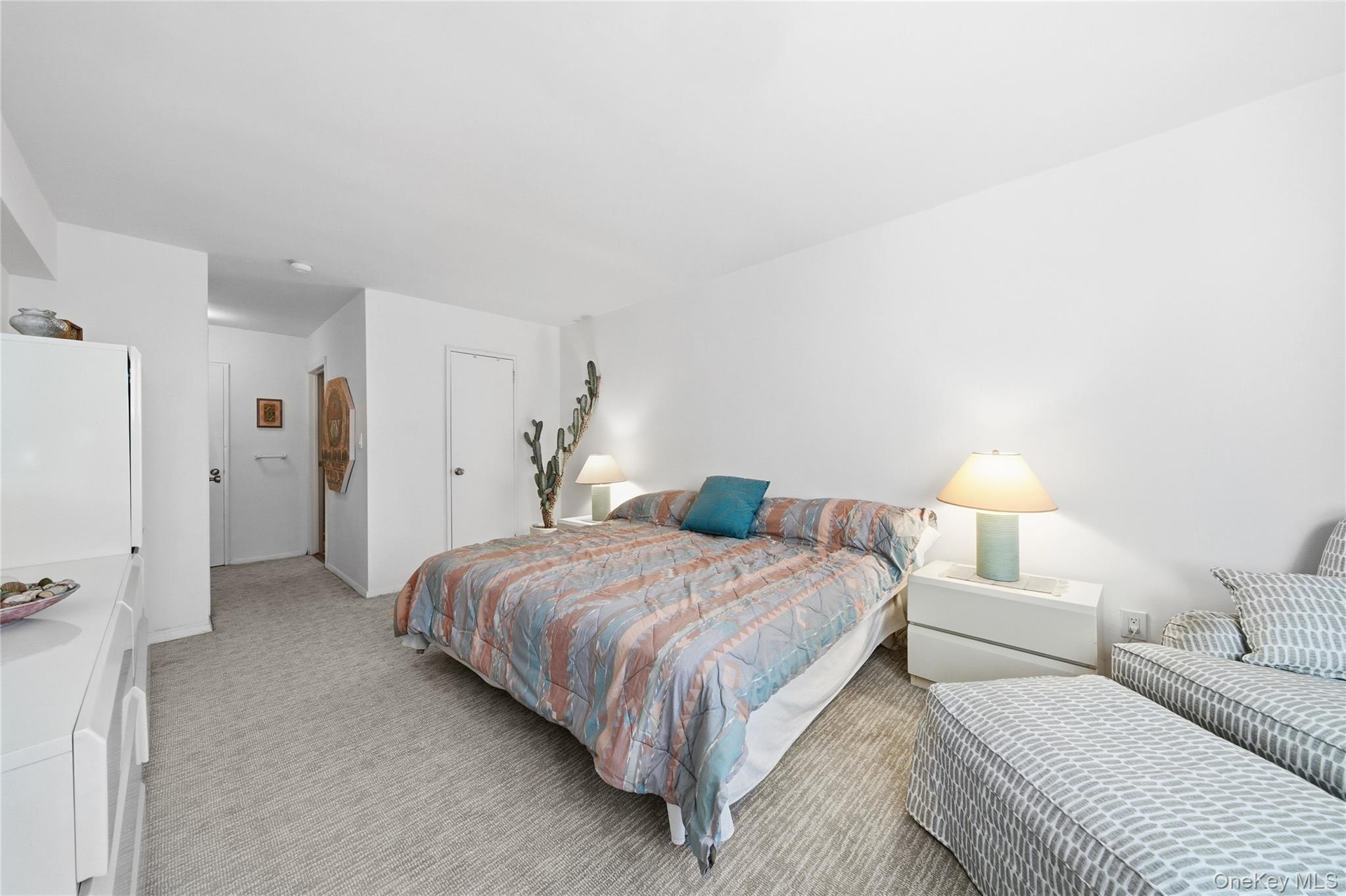 750 Shore Road, Unit 3O Long Beach, NY 11561 - Photo 14 of 23 a bedroom with a bed and a lamp