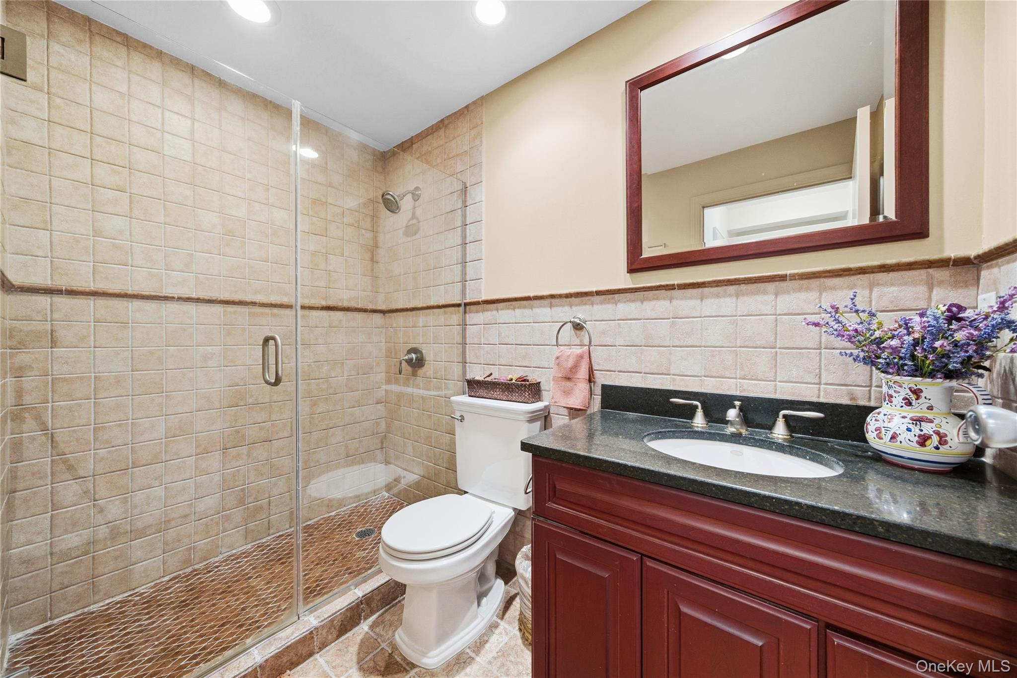 750 Shore Road, Unit 3O Long Beach, NY 11561 - Photo 15 of 23 a bathroom with a sink a toilet and shower