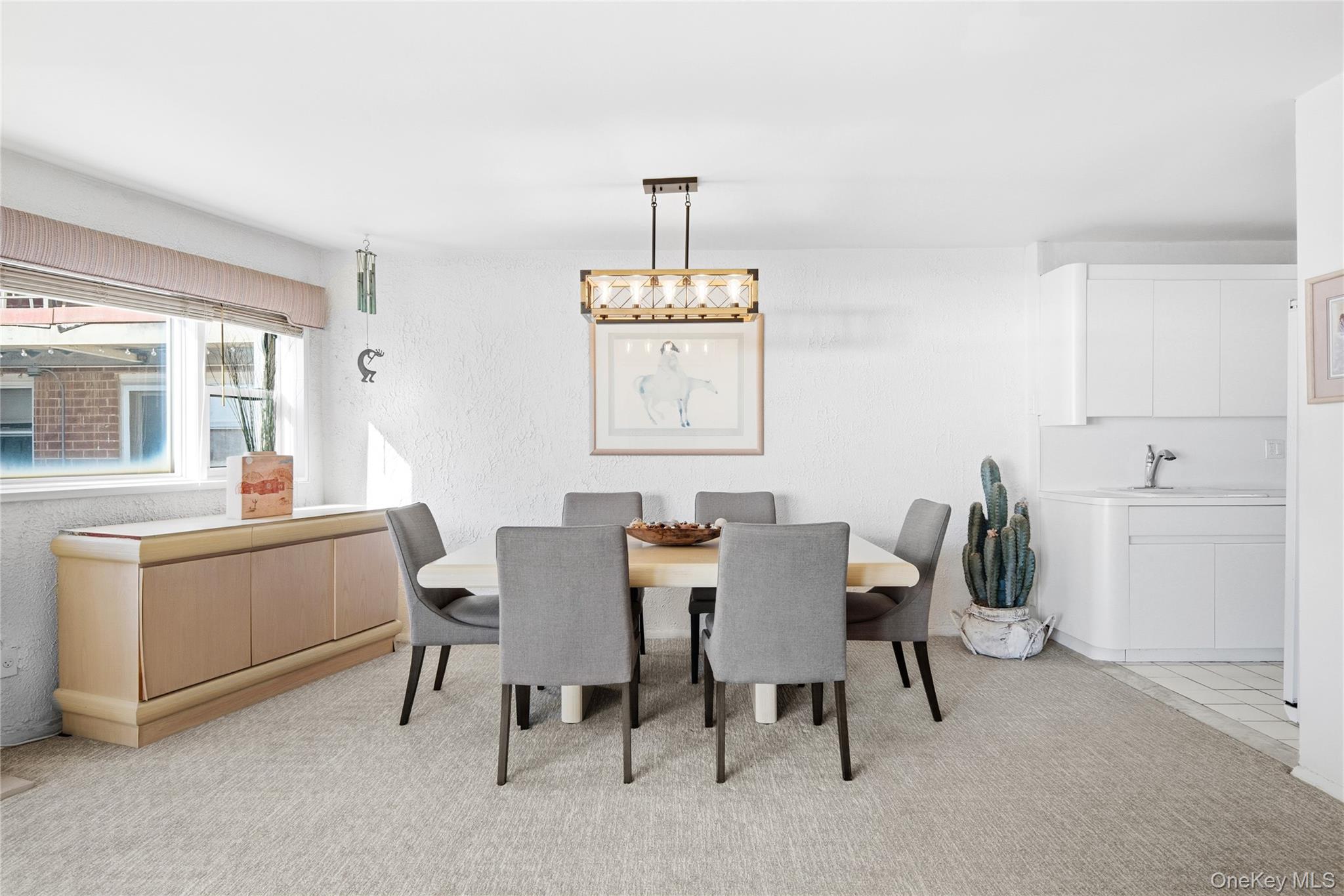 750 Shore Road, Unit 3O Long Beach, NY 11561 - Photo 5 of 23 a view of a dining room with furniture and window
