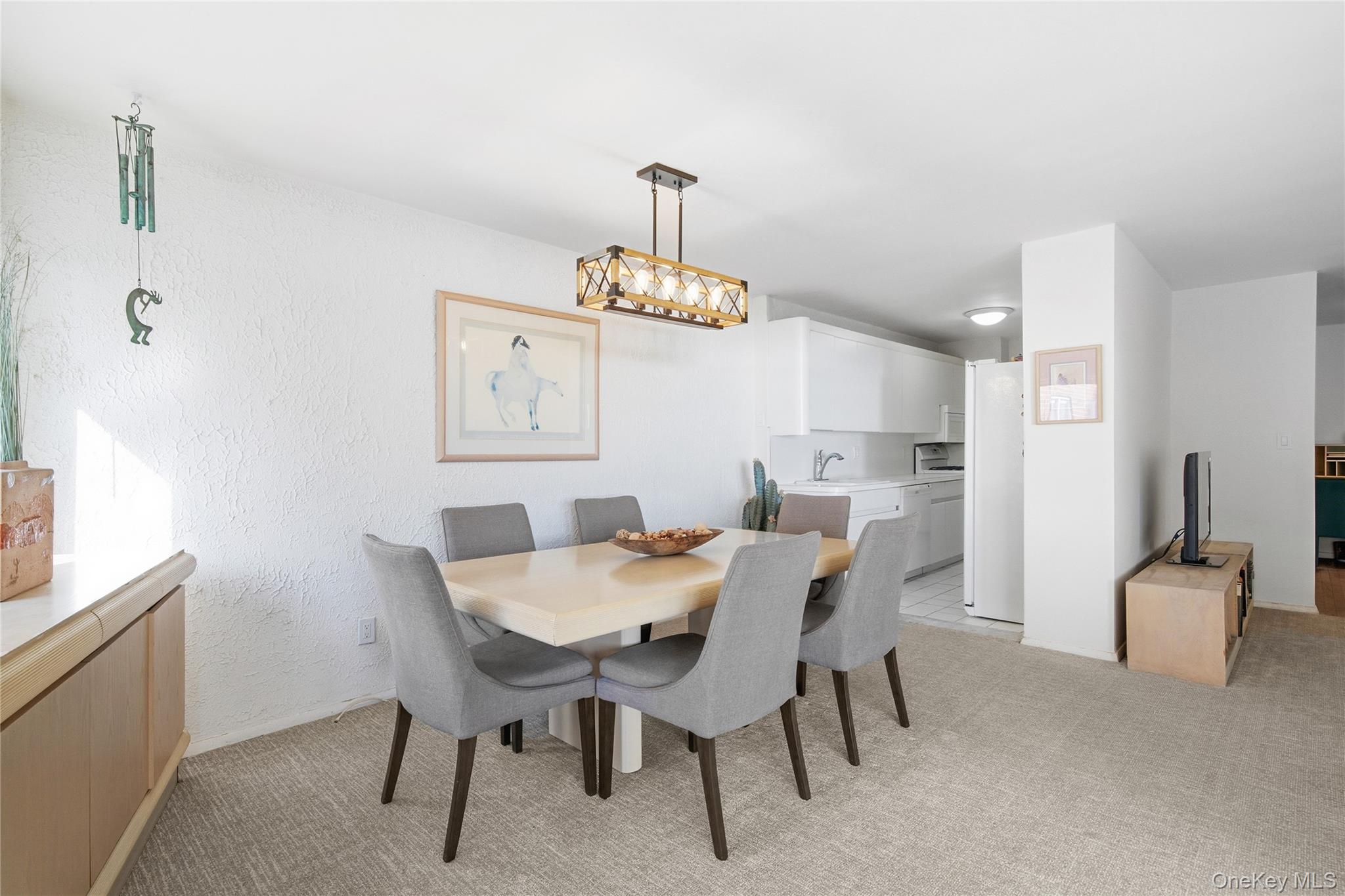 750 Shore Road, Unit 3O Long Beach, NY 11561 - Photo 6 of 23 a view of a dining room with furniture and chandelier