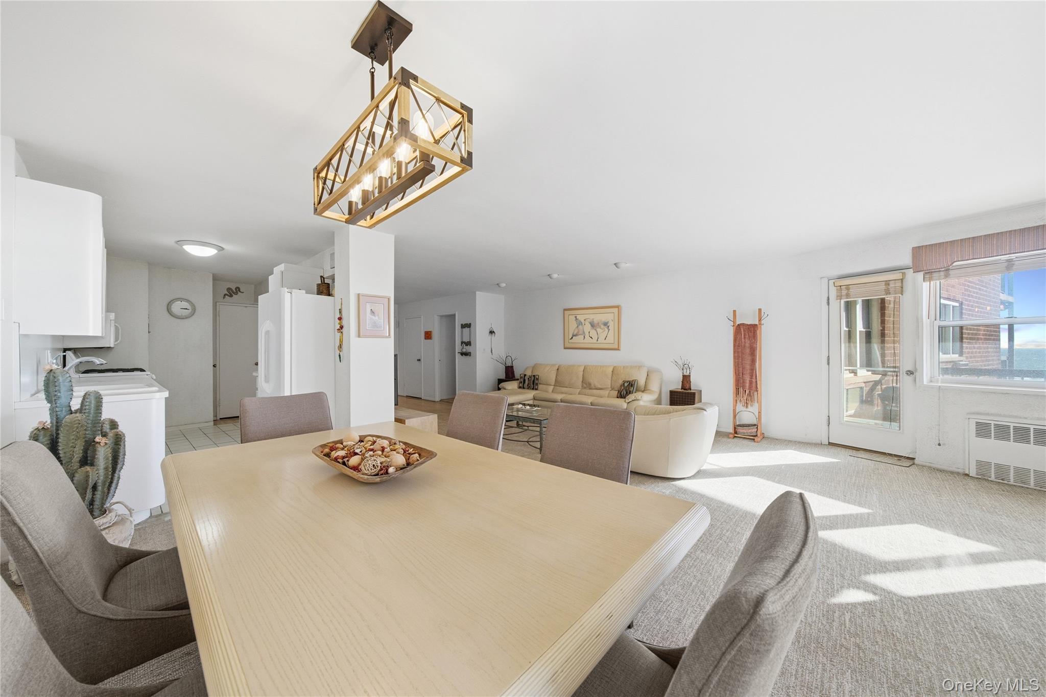 750 Shore Road, Unit 3O Long Beach, NY 11561 - Photo 7 of 23 a bedroom with a bed a couch and dresser