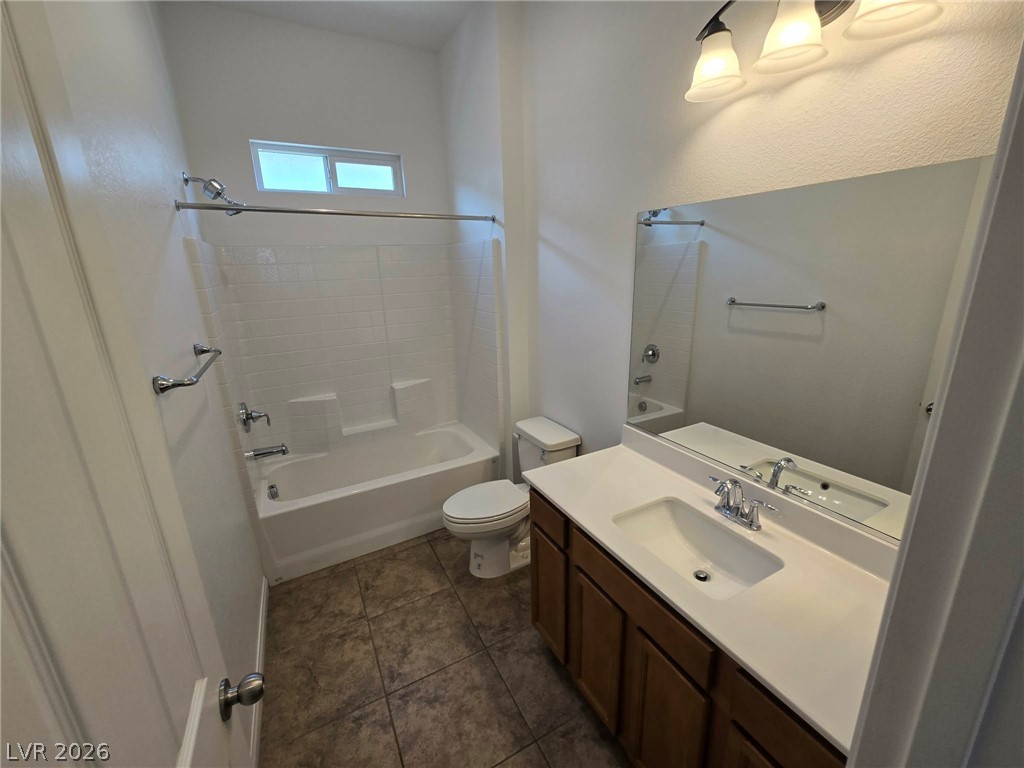 4748 Ritual Street North Las Vegas, NV 89031 - Photo 20 of 31 A well-appointed bathroom with a spacious vanity and full bath, offering both comfort and utility.