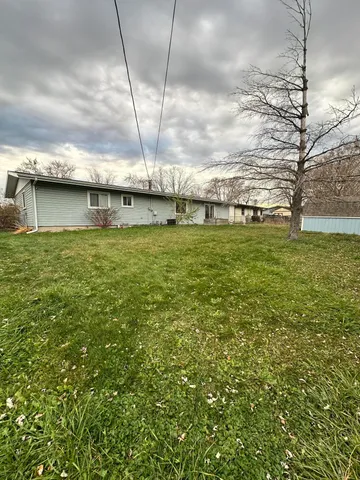 a view of a big yard with a house