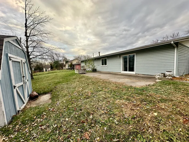 a backyard of a house with lots of green space