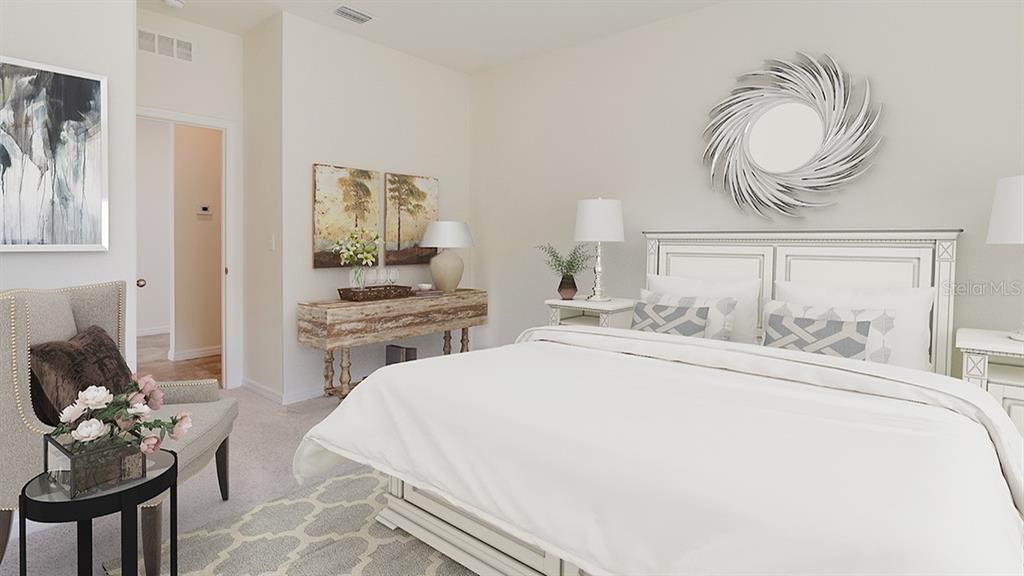 17536 Maple Grv Road Land O Lakes, FL 34638 - Photo 8 of 15 a bedroom with a bed and dresser with mirror