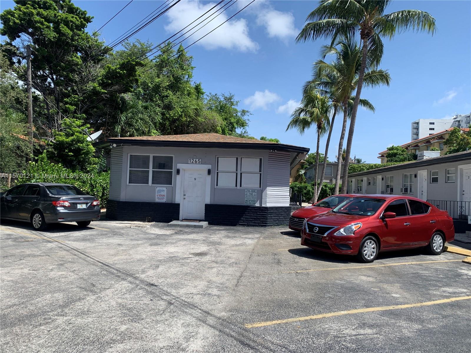 1265 Southwest 6th Street, Unit 13 Miami, FL 33135 - Photo 1 of 7 a view of a car in front of a house