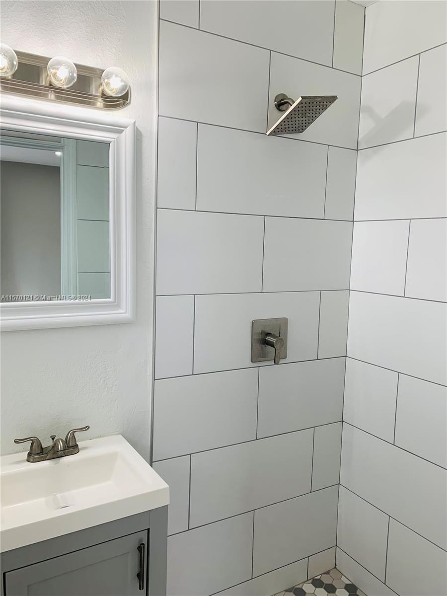1265 Southwest 6th Street, Unit 13 Miami, FL 33135 - Photo 7 of 7 a bathroom with a sink and shower