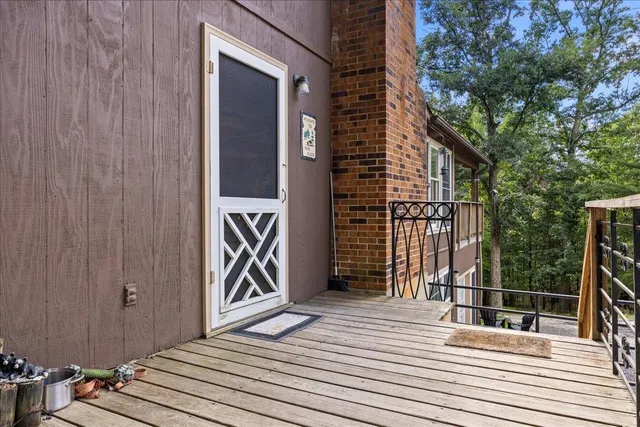 a kitchen with stainless steel appliances granite countertop a stove a sink dishwasher and cabinets with wooden floor