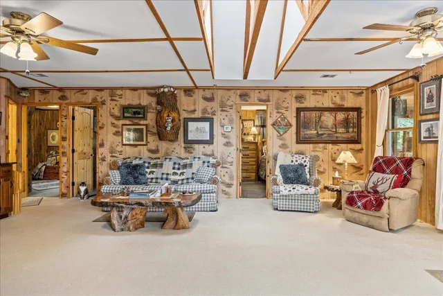 a view of walk in closet with wooden floor and a window