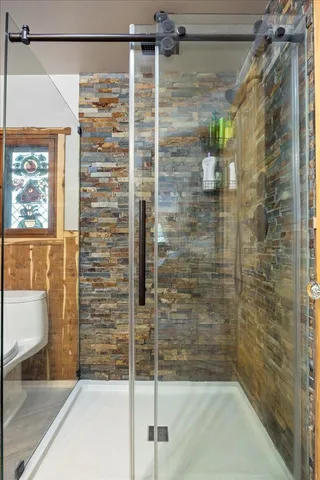 a view of a chairs in backyard of a house