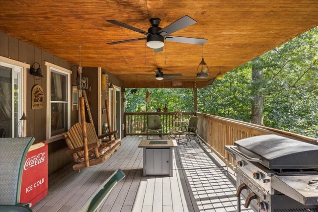 a view of a patio with a table and chairs