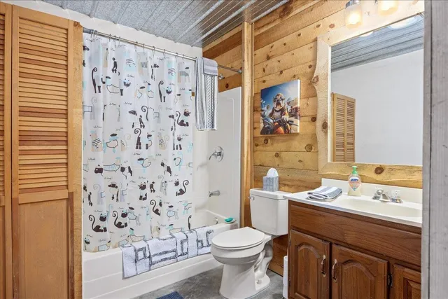 a view of a table and chairs under an umbrella