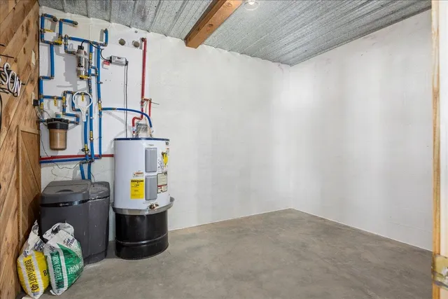 a view of a backyard with wooden fence